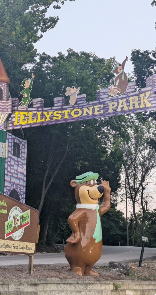A large sign displaying the words "Jellstone Park" in bold letters against a natural background