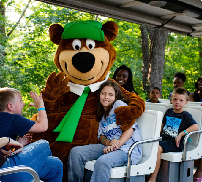 A group of diverse individuals seated on a bus