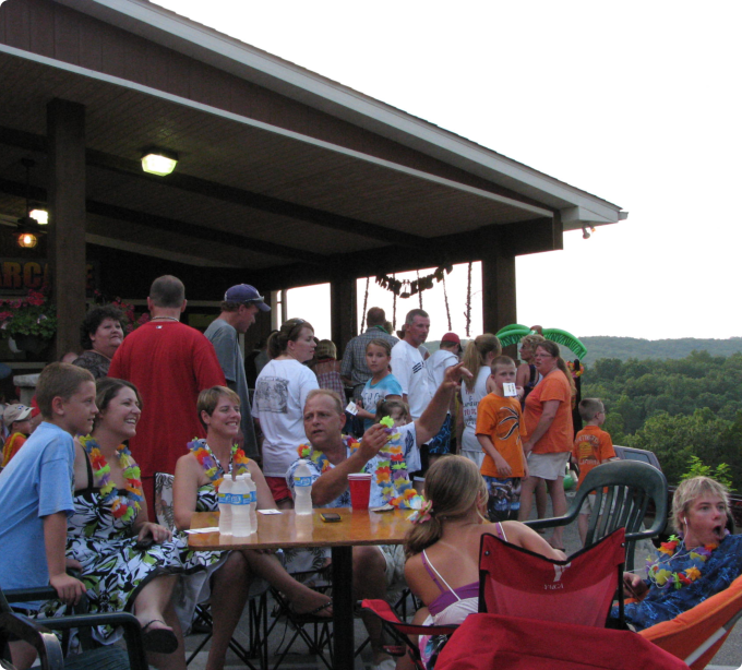 A diverse group of people seated around a table engaged in conversation