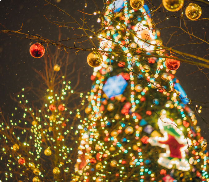 A brightly lit Christmas tree adorned with colorful lights